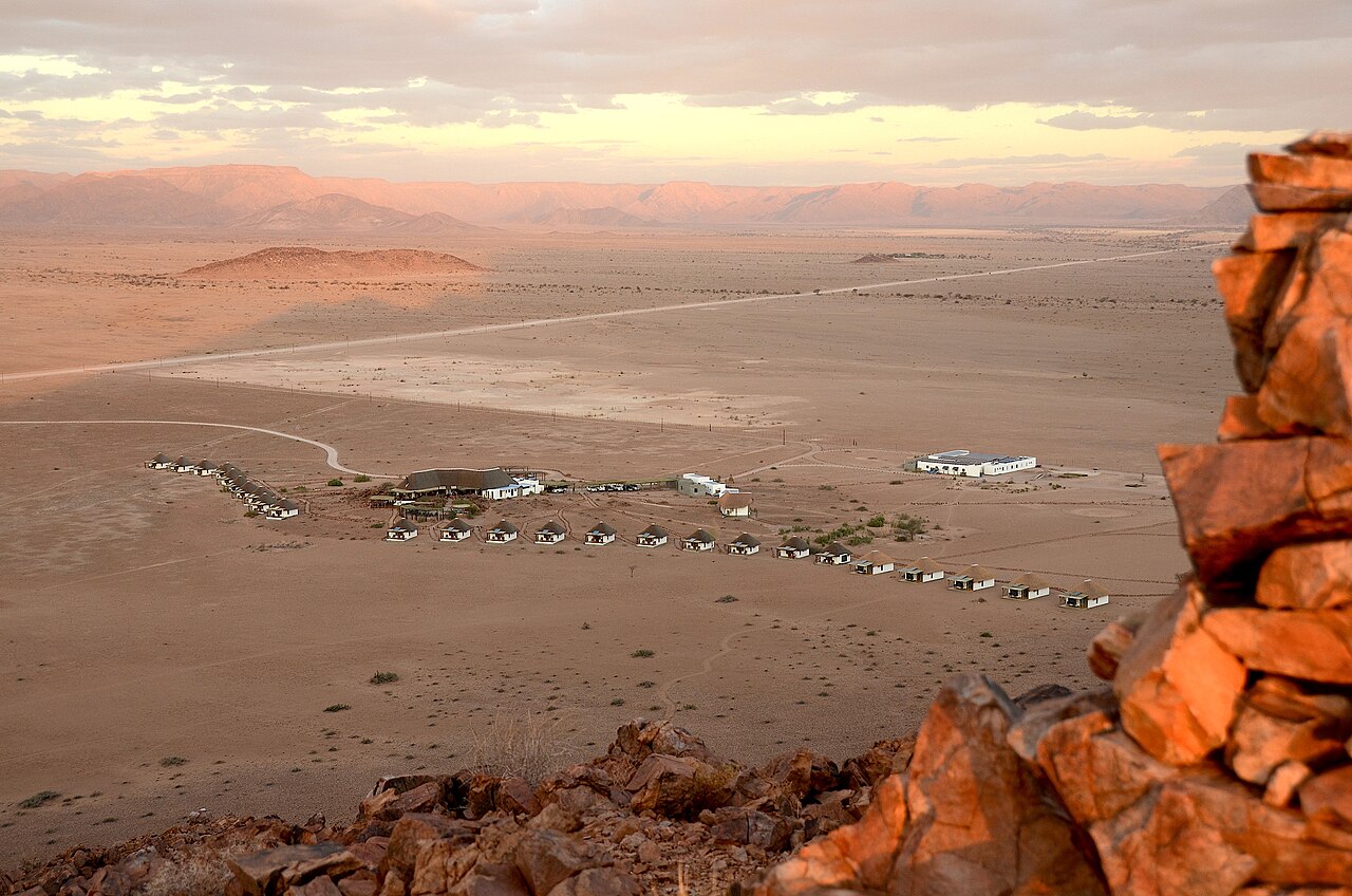 A lonely gravel road through the Namibian desert
