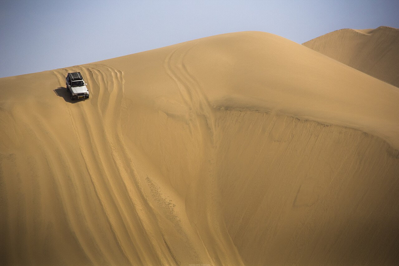 A 4x4 crossing deep desert sand