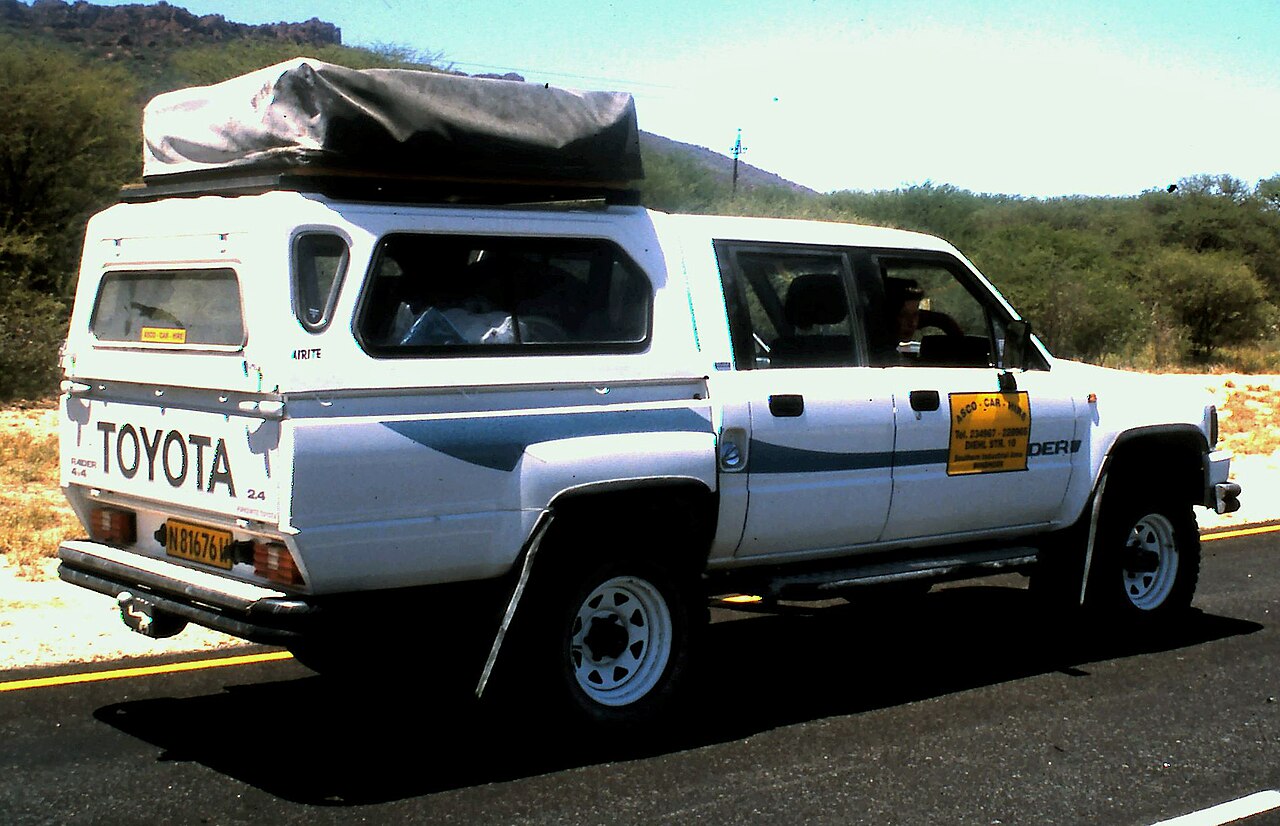 A Toyota Hilux 4x4 with a roof tent — a typical Namibia rental